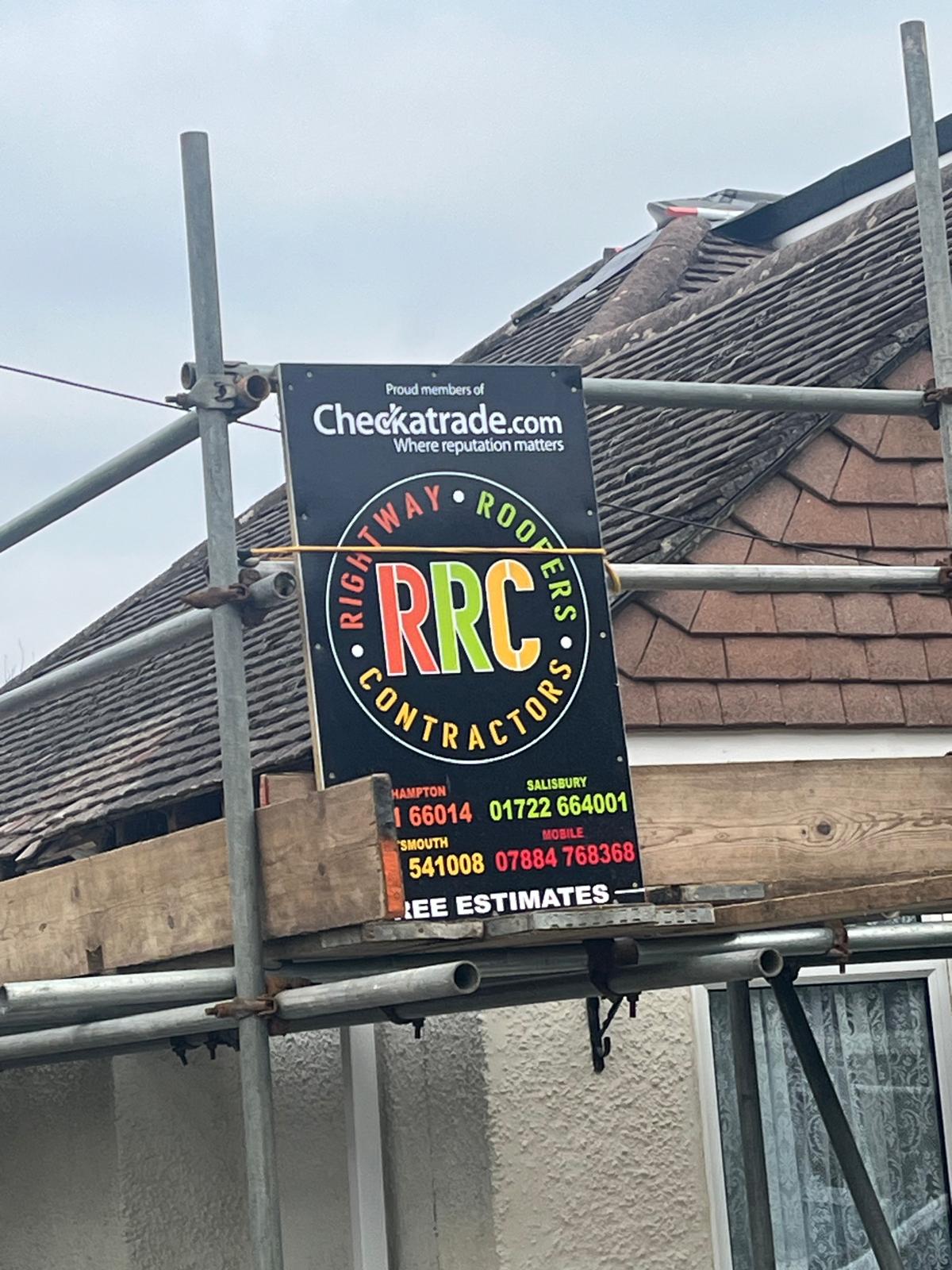 Rightway Roofers scaffold and sign on a roof repair